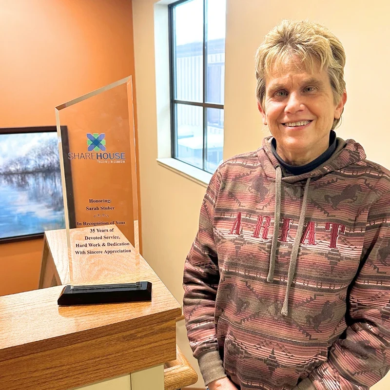 ShareHouse staff member Sarah earning 35 year anniversary award
